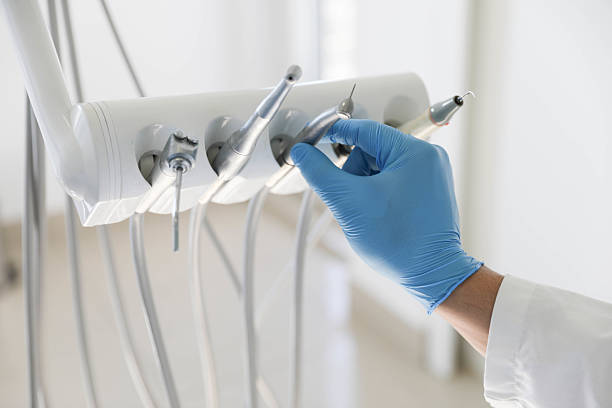 Professional Invisalign Clear Aligners technician working in Coopersville, MI